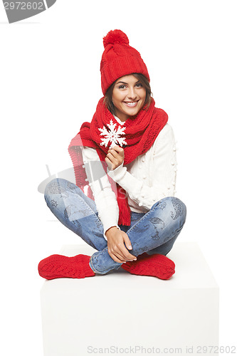 Image of Winter woman sitting on blank billboard placard sign