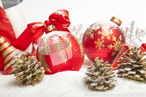 Image of Christmas ball with red bow and ribbon