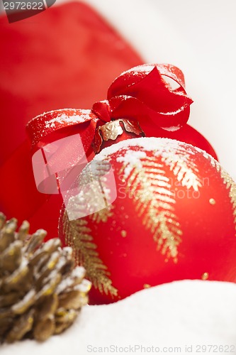 Image of Christmas ball with red bow and ribbon