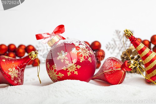 Image of Christmas ball with red bow and ribbon