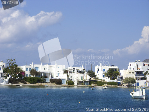 Image of typical beach community with Cyclades style white house blue doo