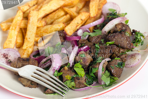 Image of Albanian liver meal with fork