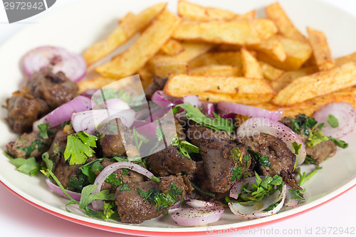 Image of Albanian liver with fries closeup