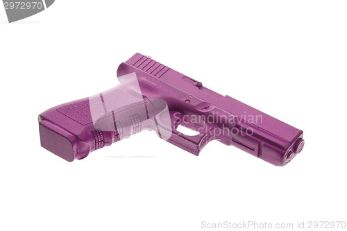 Image of Dirty pink training gun isolated on white