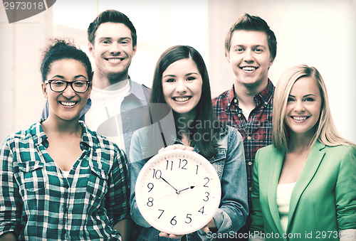 Image of group of students at school with clock