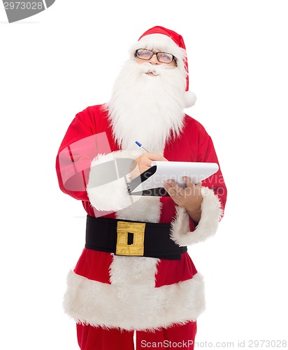 Image of man in costume of santa claus with notepad