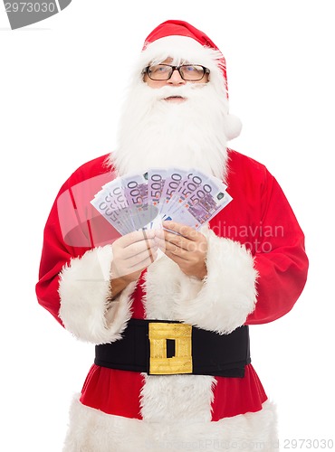 Image of man in costume of santa claus with euro money