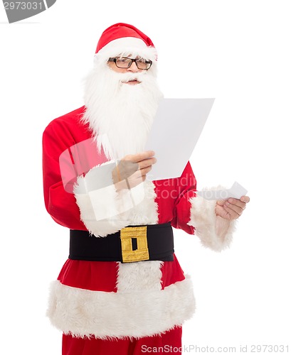 Image of man in costume of santa claus with letter