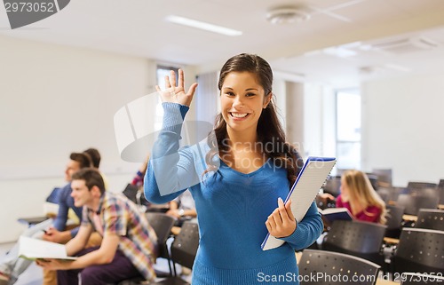 Image of group of smiling students in lecture hall