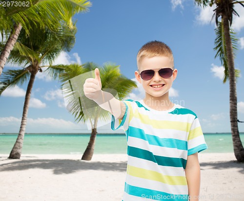 Image of smiling little boy over green background