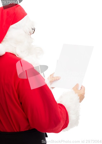 Image of man in costume of santa claus with letter