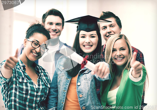 Image of student girl in graduation cap with diploma