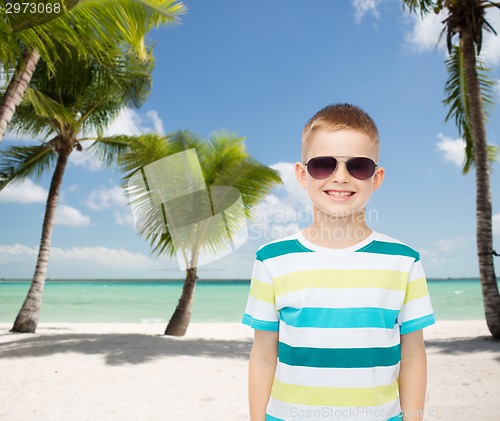 Image of smiling little boy over green background