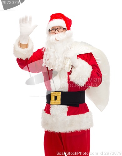 Image of man in costume of santa claus with bag