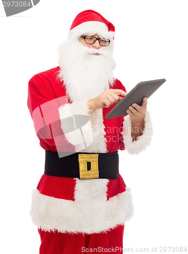 Image of man in costume of santa claus with tablet pc