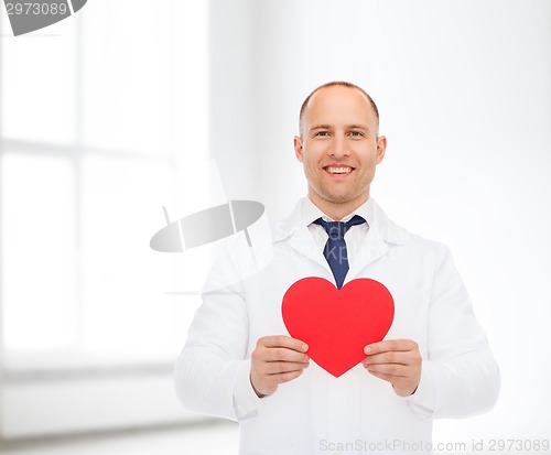 Image of smiling male doctor with red heart