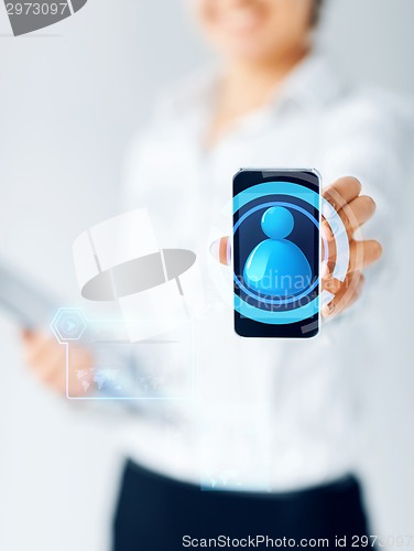 Image of close up of businesswoman showing smartphone