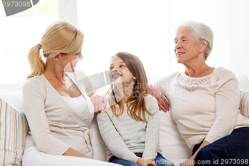 Image of smiling family at home