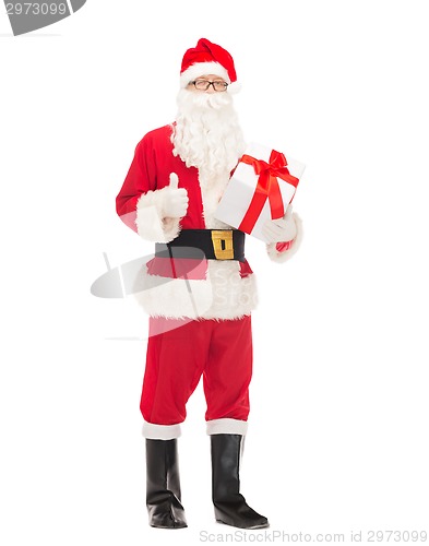 Image of man in costume of santa claus with gift box