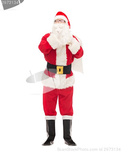 Image of man in costume of santa claus with bag