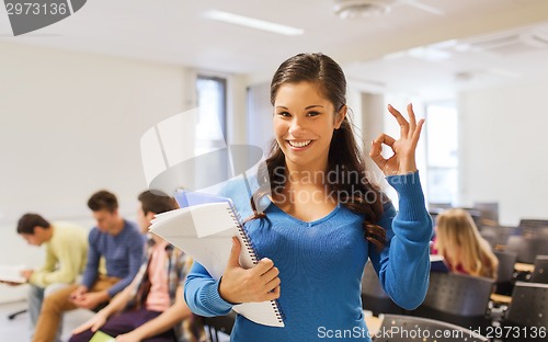 Image of group of smiling students in lecture hall