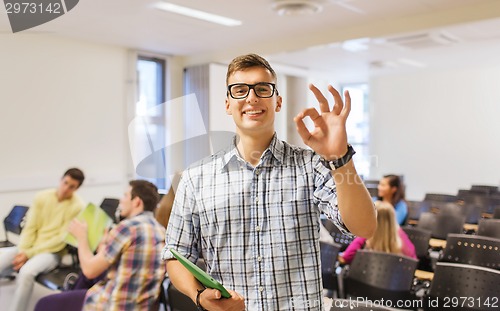 Image of group of smiling students in lecture hall