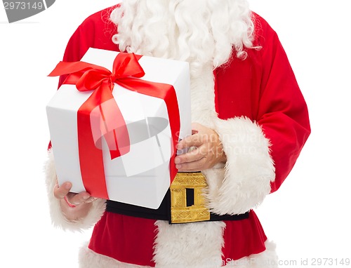 Image of man in costume of santa claus with gift box