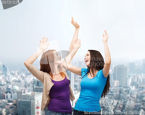 Image of smiling teenage girls having fun