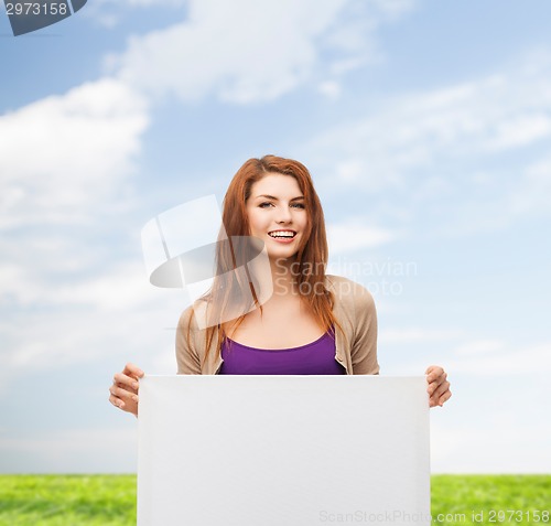 Image of smiling teenage with white board