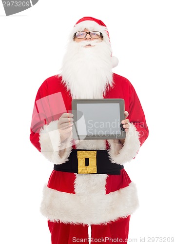 Image of man in costume of santa claus with tablet pc