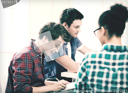 Image of student with notebook studying at school