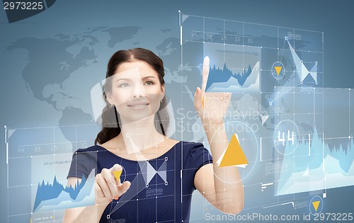 Image of smiling businesswoman working with virtual screen