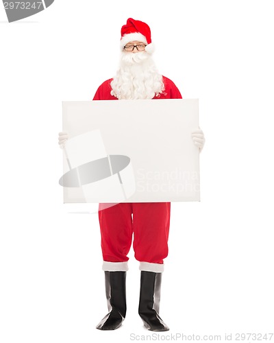 Image of man in costume of santa claus with billboard