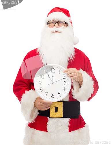 Image of man in costume of santa claus with clock