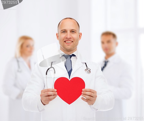 Image of smiling male doctor with red heart and stethoscope