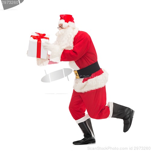 Image of man in costume of santa claus with gift box