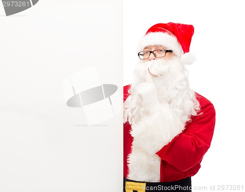 Image of man in costume of santa claus with billboard