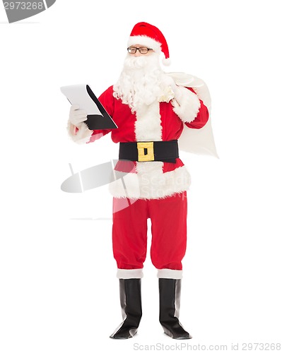 Image of man in costume of santa claus with notepad and bag