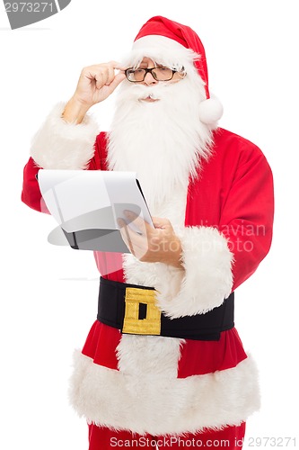 Image of man in costume of santa claus with notepad