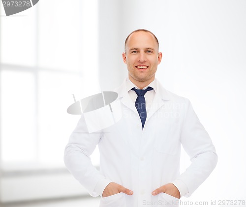 Image of smiling male doctor in white coat