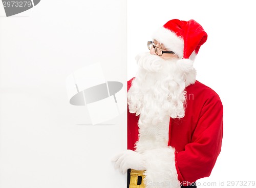Image of man in costume of santa claus with billboard