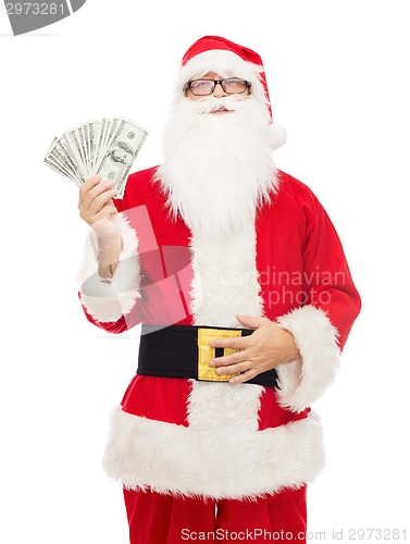 Image of man in costume of santa claus with dollar money