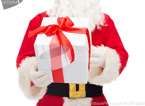 Image of man in costume of santa claus with gift box