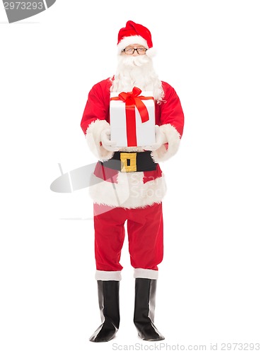 Image of man in costume of santa claus with gift box