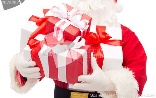 Image of close up of santa claus with gift boxes