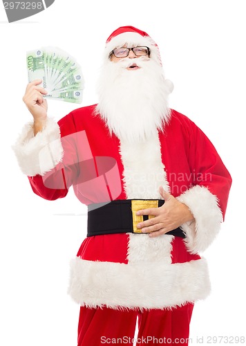 Image of man in costume of santa claus with euro money