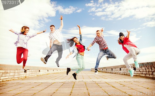 Image of group of teenagers jumping