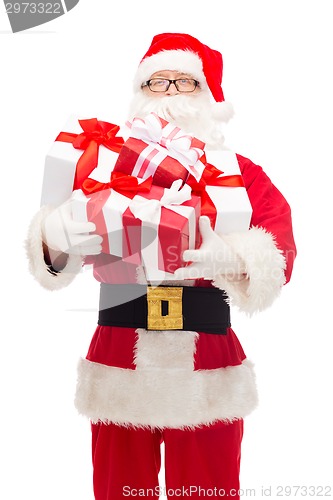 Image of man in costume of santa claus with gift boxes