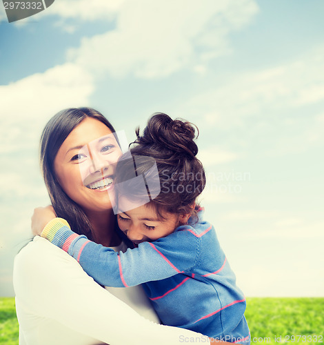 Image of hugging mother and daughter