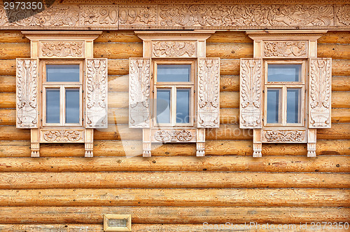 Image of Windows on the wooden house facade. Old Russian country style